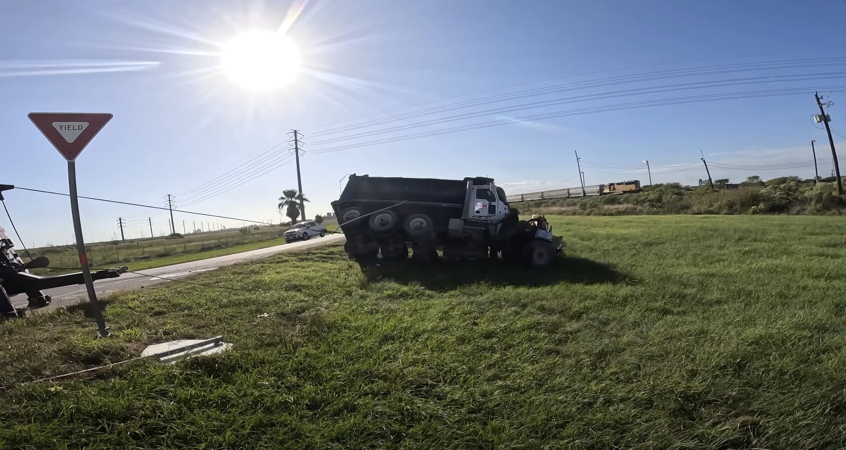Expert accident recovery and vehicle uprighting service Professional accident recovery showing overturned commercial vehicle being safely recovered from roadway